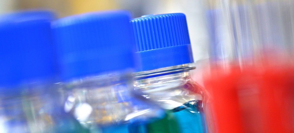 Close up of blue vials in a blur.